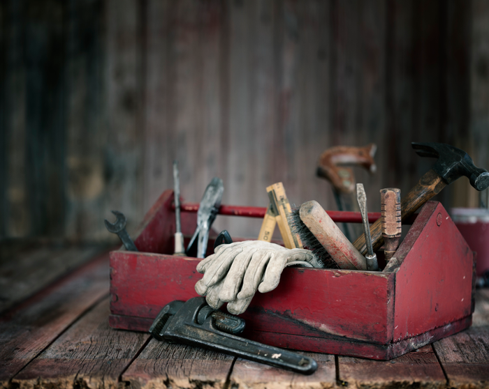 plumbing tools and fittings on blue background with copy space