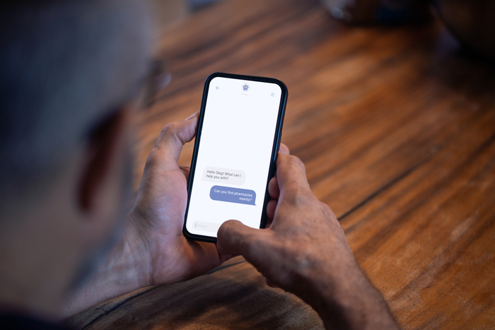 person holding smartphone reading customer review
