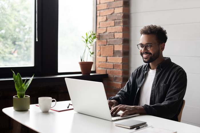 Young man working from home. Creative professional have meeting online