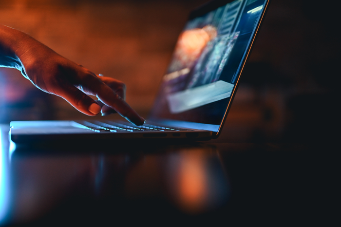false hand typing on computer keyboard