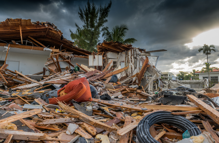 A house reduced to complete rubble and debris after a storm destroyed it
