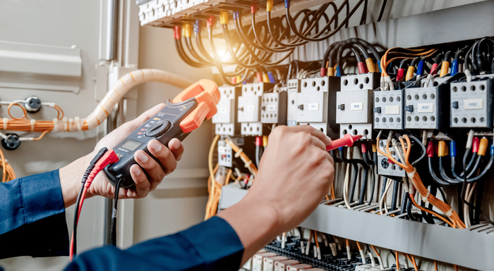 Contractor working on open electrical panel
