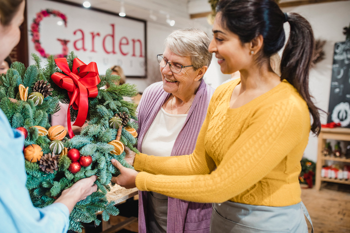 Choosing a Christmas Wreath at the Florist