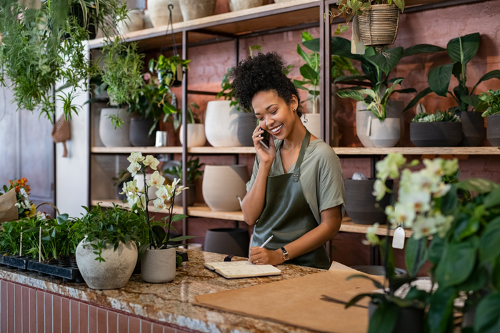 woman business owner in a plant shop