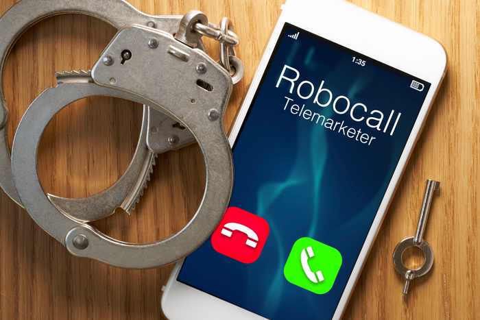 Telemarketer robocall scam: legislation for smartphone with gavel