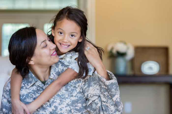 Cheerful military mom is reunited with adorable daughter