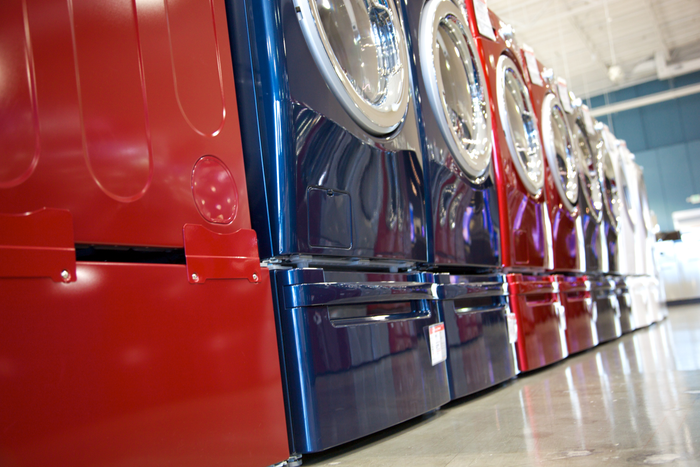 Shallow DOF on washer and dryer sales in a high end appliance store