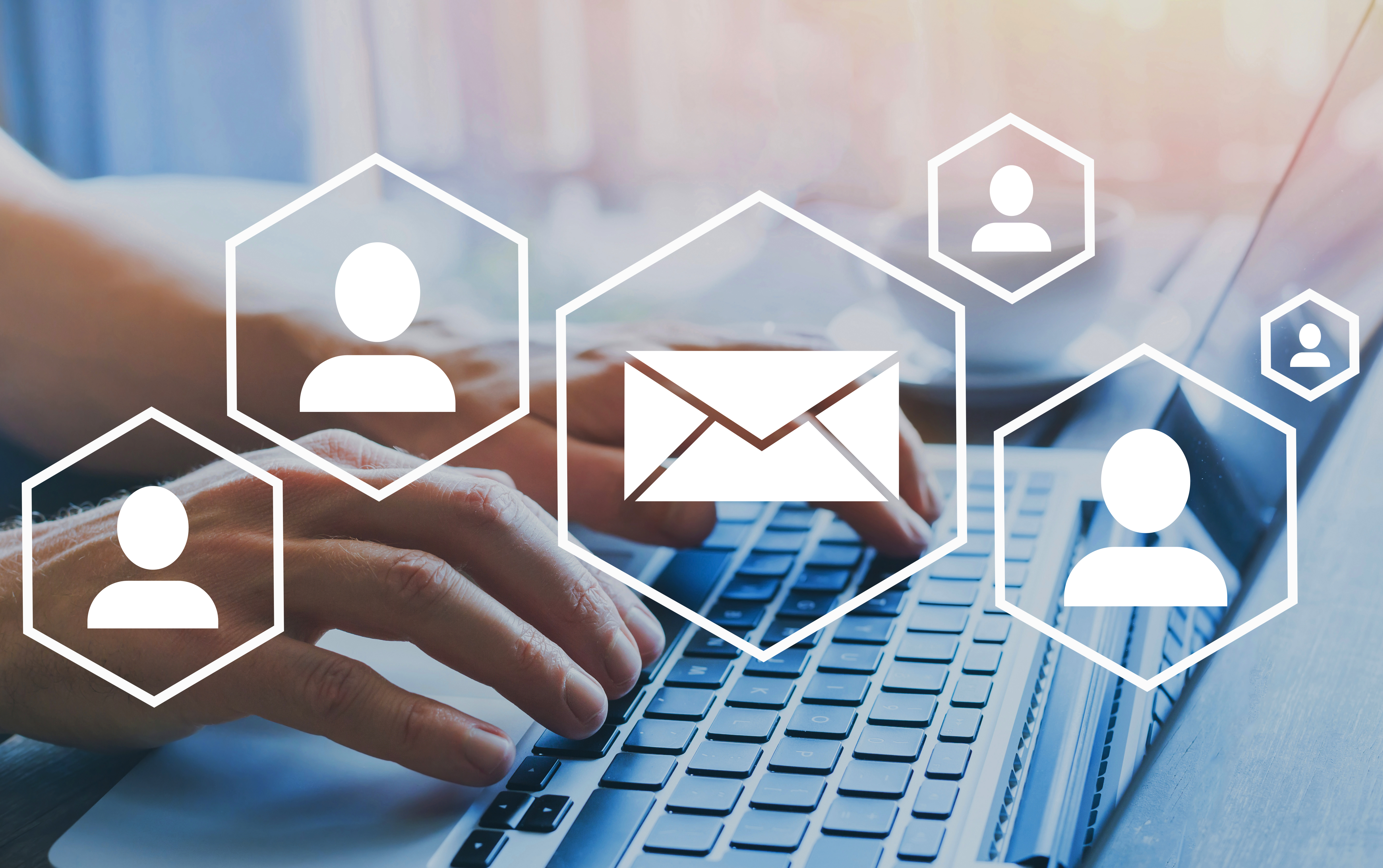 email marketing or newsletter concept, diagram with icons, hands typing on computer as background