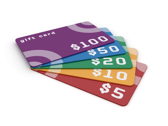multicolored gift cards of various increments against a white background