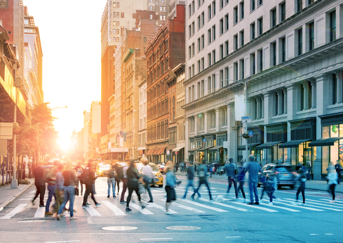 false Crowds of people in motion across the busy intersection of 23rd Street and 5th Avenue in Midtown Manhattan, New York City