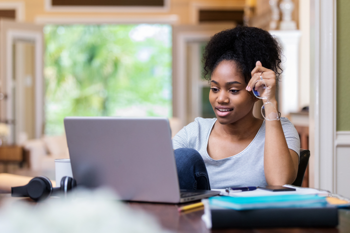 Confident young college student studies for test