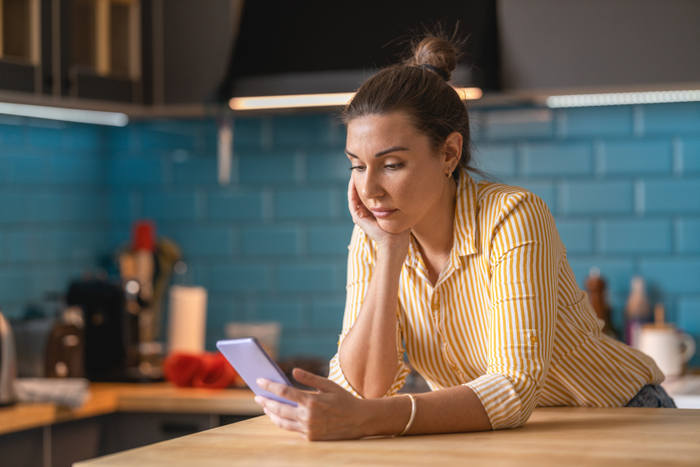 false Young woman typing on smart phone