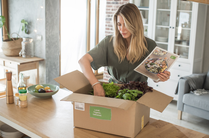 Woman got package from meal delivery service.