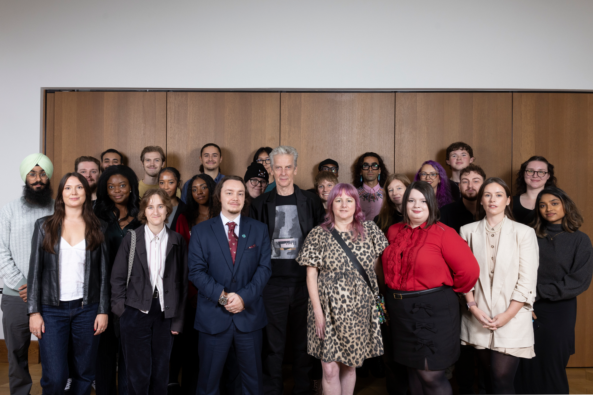 A group shot of 2025's bursary recipients with Peter Capaldi.