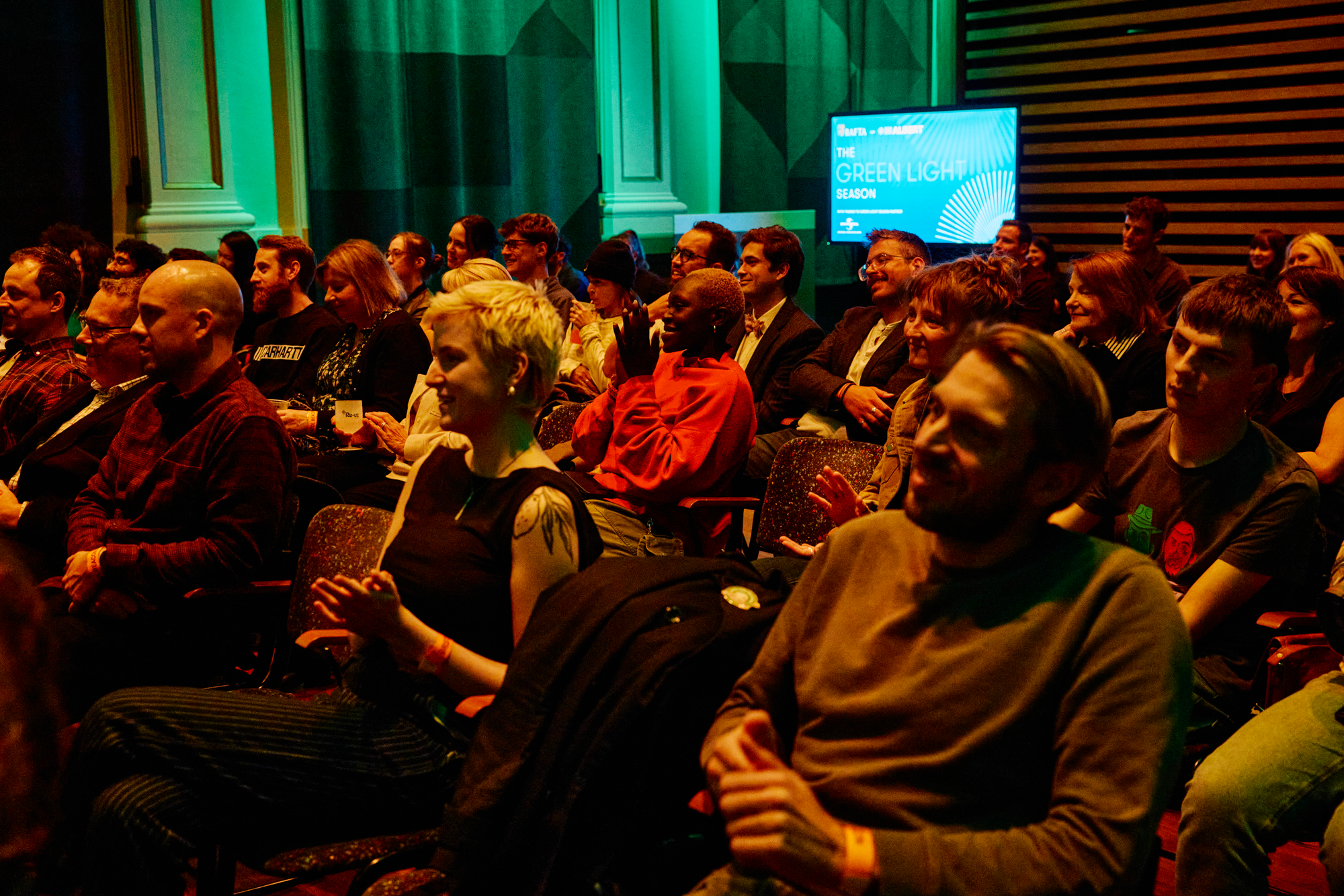 Rows of guests attend a Green Light: Make It Matter event in Bristol.